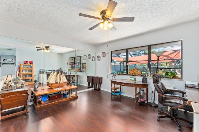 home office featuring dark wood-type flooring, ceiling fan, and a textured ceiling