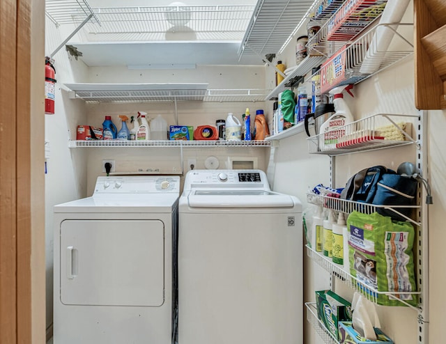 laundry area with separate washer and dryer