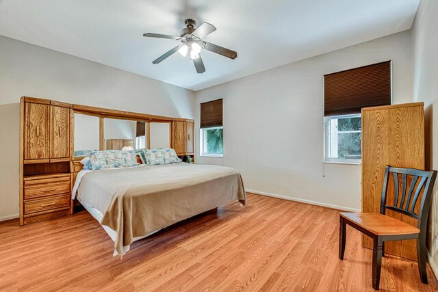 bedroom featuring light wood-type flooring and ceiling fan