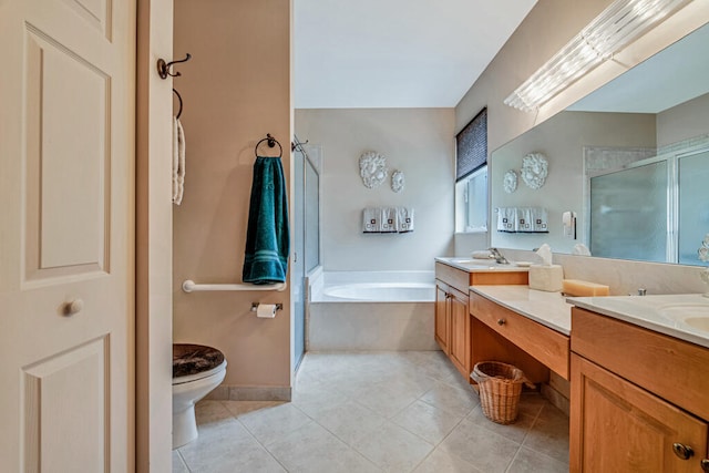 full bathroom featuring toilet, shower with separate bathtub, vanity, and tile patterned floors