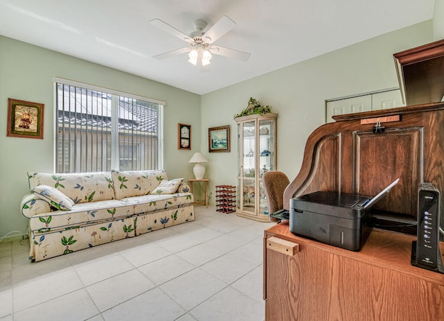 living room with light tile patterned flooring and ceiling fan