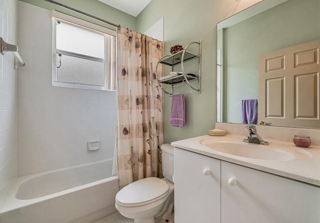 full bathroom featuring toilet, vanity, and shower / bathtub combination with curtain