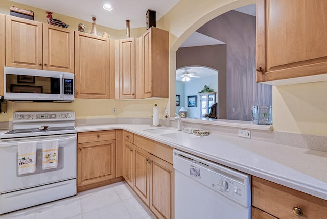 kitchen with white appliances, ceiling fan, light tile patterned floors, and light brown cabinets