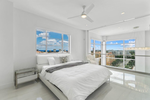 bedroom featuring baseboards and a ceiling fan