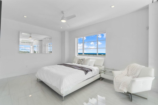 tiled bedroom with ceiling fan