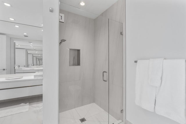 full bathroom featuring recessed lighting, a shower stall, and vanity