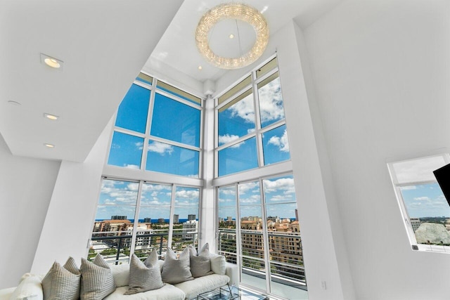 living room with a wealth of natural light and a towering ceiling