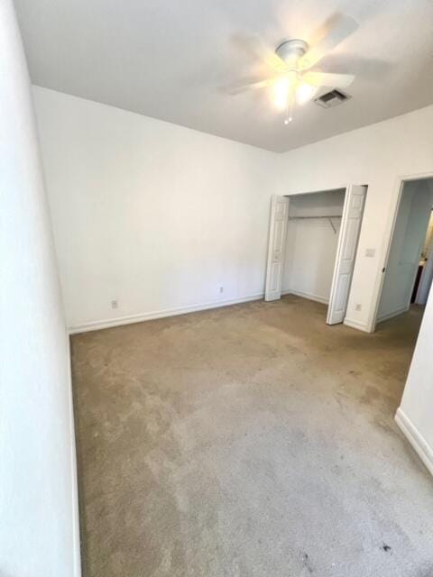 unfurnished bedroom featuring carpet flooring and ceiling fan