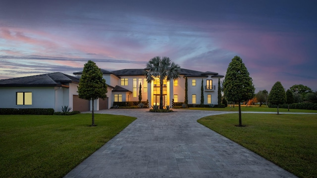 view of front of property with a lawn