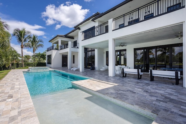 view of swimming pool with an in ground hot tub, ceiling fan, and a patio area