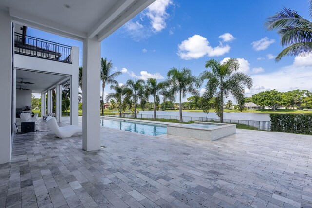 pool at dusk featuring a patio area