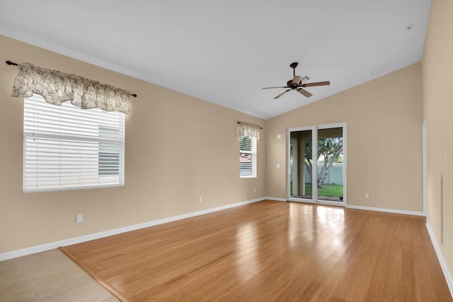 2609 SW Gallery Cir, Palm City, FL 34990 - spare room with a ceiling fan, lofted ceiling, baseboards, and wood finished floors