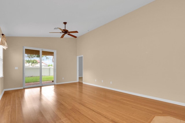 2609 SW Gallery Cir, Palm City, FL 34990 - spare room featuring light wood-style floors, a ceiling fan, lofted ceiling, and baseboards