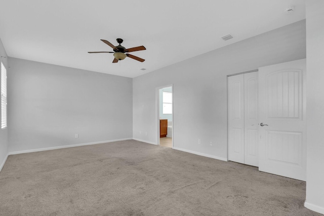 2609 SW Gallery Cir, Palm City, FL 34990 - unfurnished bedroom featuring carpet, baseboards, ensuite bath, and a closet