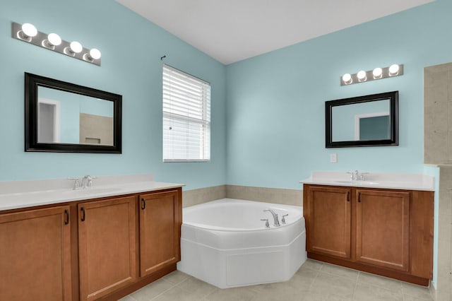2609 SW Gallery Cir, Palm City, FL 34990 - full bathroom with two vanities, a bath, and tile patterned floors