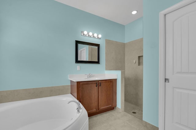 2609 SW Gallery Cir, Palm City, FL 34990 - bathroom featuring a garden tub, vanity, tile patterned flooring, and tiled shower