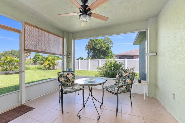 sunroom / solarium with ceiling fan