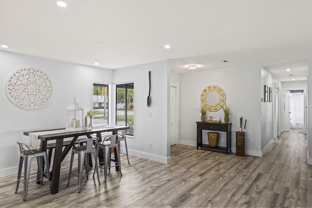 dining space featuring wood-type flooring