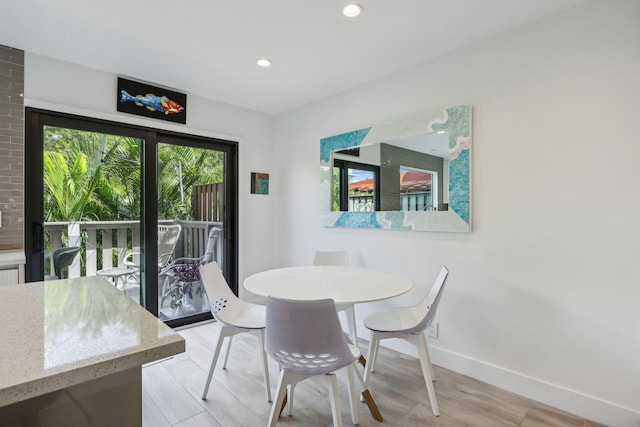 dining room with light hardwood / wood-style floors