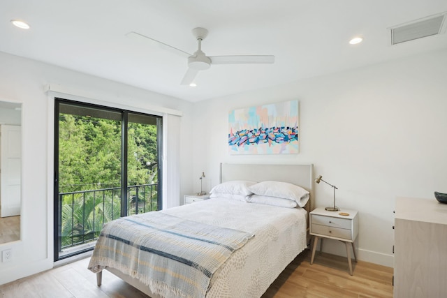 bedroom featuring access to outside, light hardwood / wood-style flooring, and ceiling fan