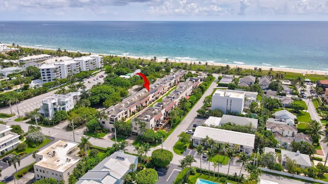 aerial view featuring a water view and a beach view