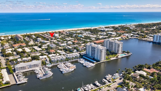 birds eye view of property featuring a view of the beach and a water view