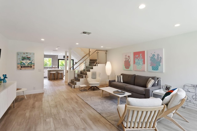 living room with light hardwood / wood-style flooring