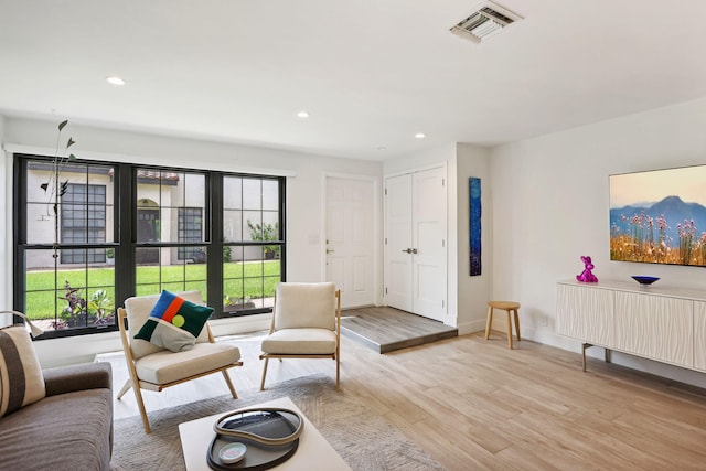 living room with light hardwood / wood-style floors