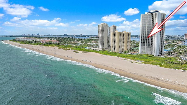 bird's eye view featuring a view of the beach and a water view