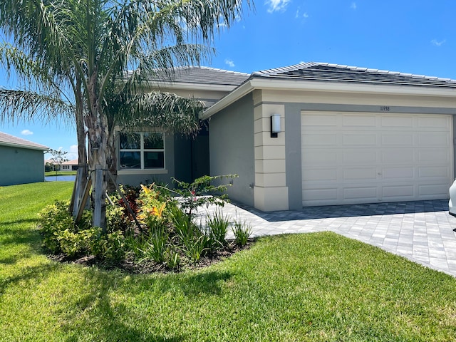 view of property exterior with a garage and a lawn