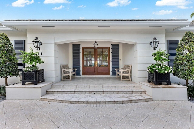 doorway to property with french doors and a porch