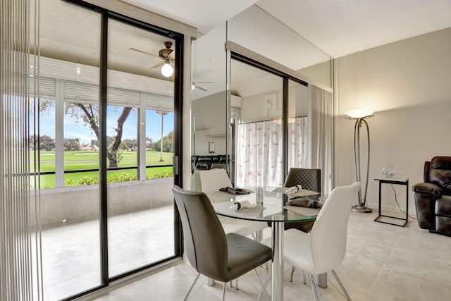 dining space with ceiling fan and light tile patterned floors