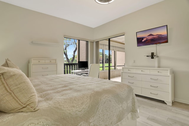 bedroom with a closet and light hardwood / wood-style flooring