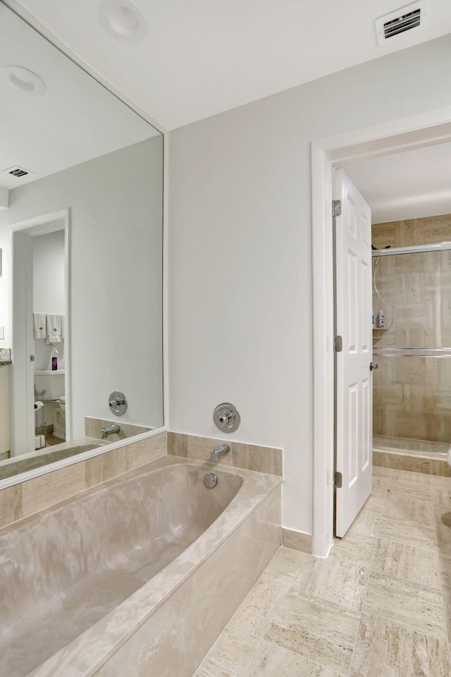 full bath featuring visible vents, a bath, and a shower stall