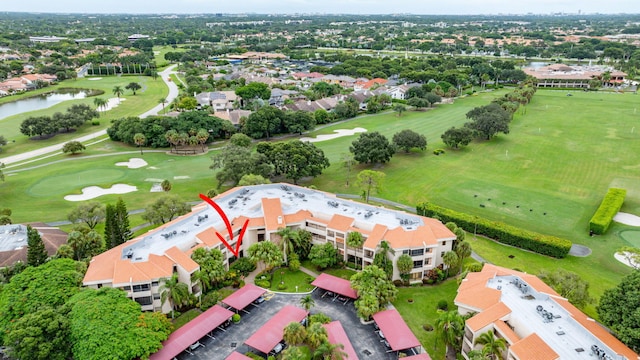 aerial view with a water view and golf course view