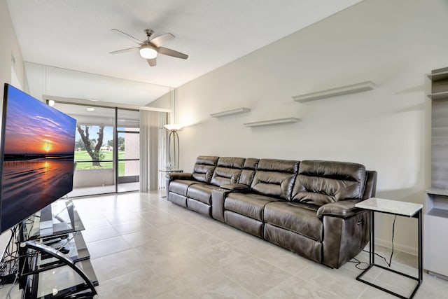 tiled living room with ceiling fan and vaulted ceiling