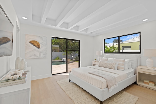 bedroom featuring light wood-type flooring, multiple windows, beamed ceiling, and access to exterior