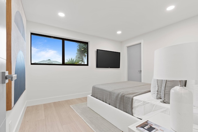 bedroom with light hardwood / wood-style floors