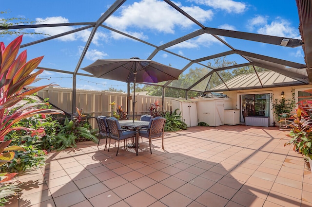 view of patio with glass enclosure