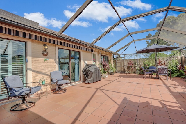 view of patio / terrace featuring a lanai