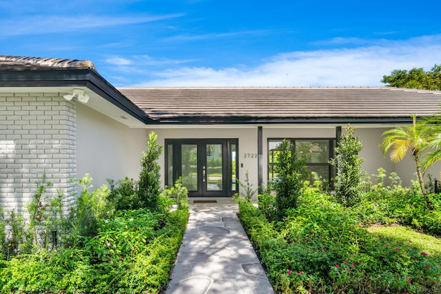 entrance to property featuring french doors