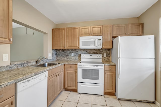 kitchen featuring light tile patterned floors, light brown cabinets, white appliances, a sink, and tasteful backsplash