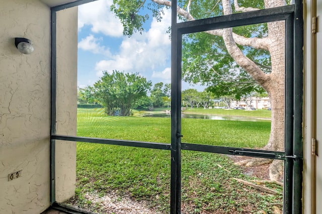 unfurnished sunroom with a water view and plenty of natural light