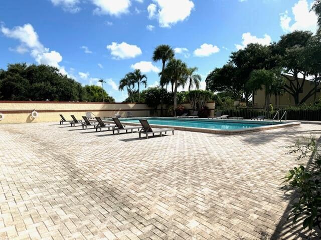 view of swimming pool with a patio area