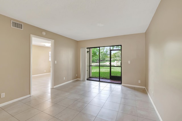 empty room with light tile patterned floors