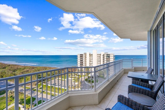 balcony featuring a water view