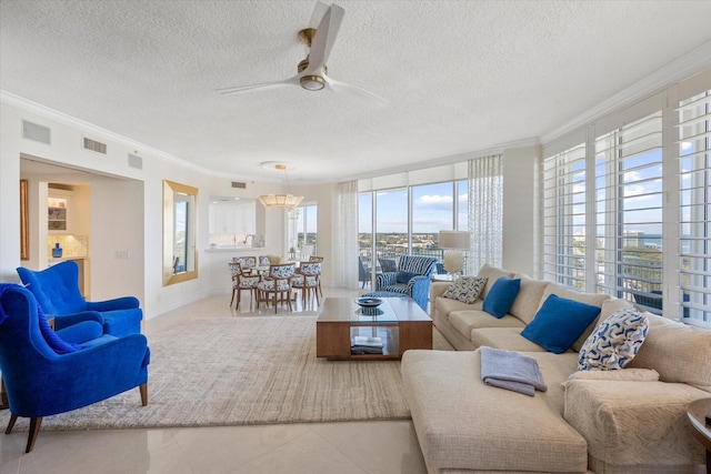 tiled living room with ornamental molding, a healthy amount of sunlight, and a textured ceiling