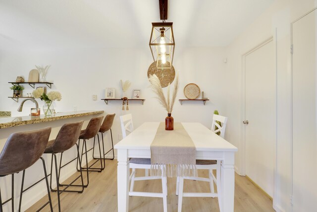 dining space featuring light hardwood / wood-style floors