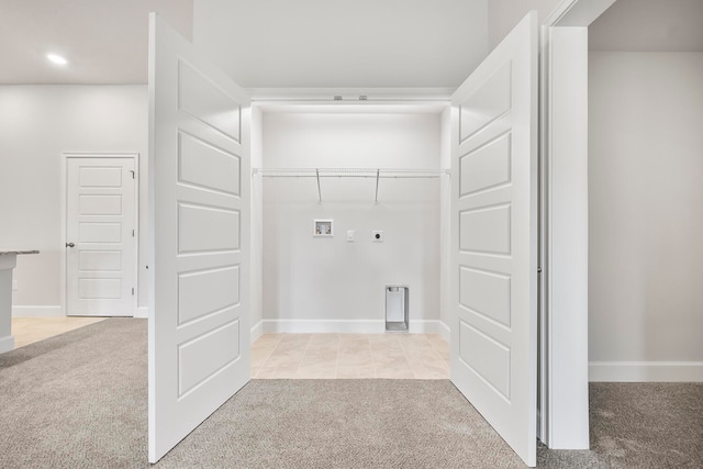 laundry room with hookup for an electric dryer, hookup for a washing machine, and light colored carpet