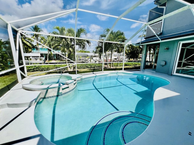 view of pool featuring an in ground hot tub and glass enclosure